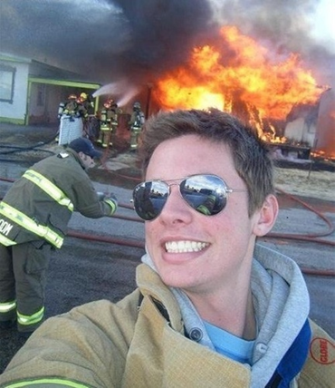 Selfie in front of a burning house